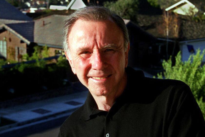 Ray Watson is shown at his East Bluff Village home in Newport Beach.