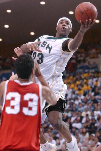 St. Vincent-St. Mary's LeBron James (R) goes up for a basket past Mater Dei's Marcel Jones in the second quarter, in Los Angeles, CA, 04 January 2003. St. Vincent-St. Mary won 64-58 with James scoring 21 points. James, 17, is expected to be the number one pick in the NBA draft this spring, following Kevin Garnett and Kobe Bryant in entering the NBA from high school.