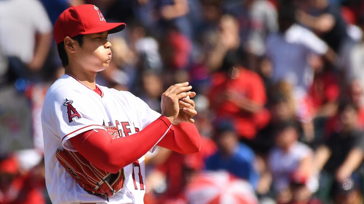 Angels pitcher Shohei Ohtani is shown shortly after giving up a single against the Athletics to break up the perfect game in the seventh inning.