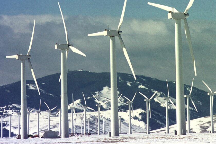 Wind turbines spin at the Foote Creek Rim site in Carbon County, Wyo.