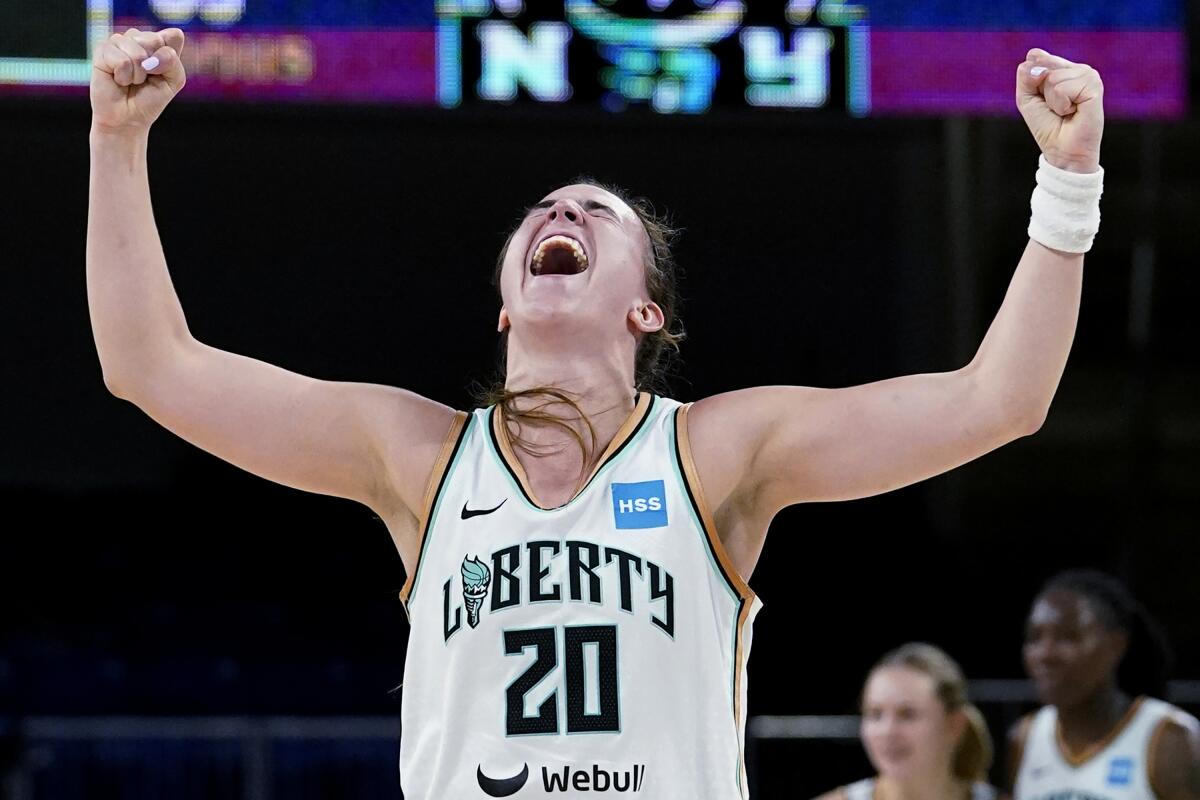 New York Liberty guard Sabrina Ionescu reacts after the Liberty defeated the Chicago Sky 98-91 in Game 1 of a WNBA basketball first-round playoff series Wednesday, Aug. 17, 2022, in Chicago. (AP Photo/Nam Y. Huh)