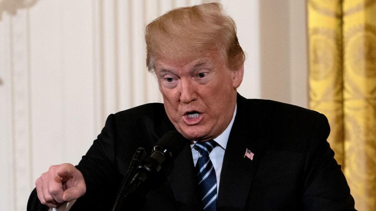 President Trump addresses a meeting at the White House on May 18.