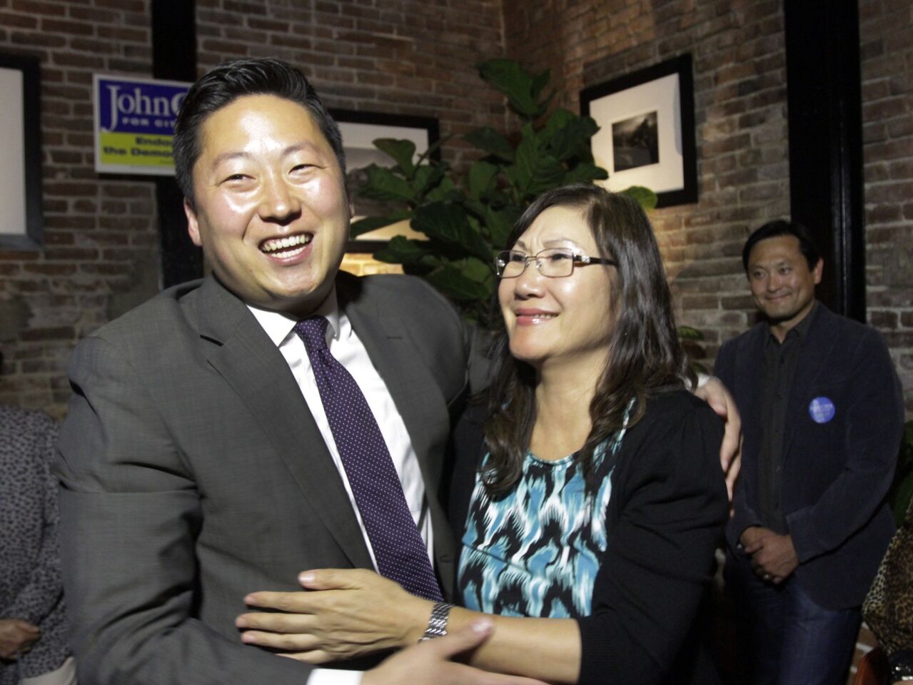 John Choi, a candidate for Council District 13, hugs his mother, Myung Choi, on election night at Mohawk Bend Restaurant.