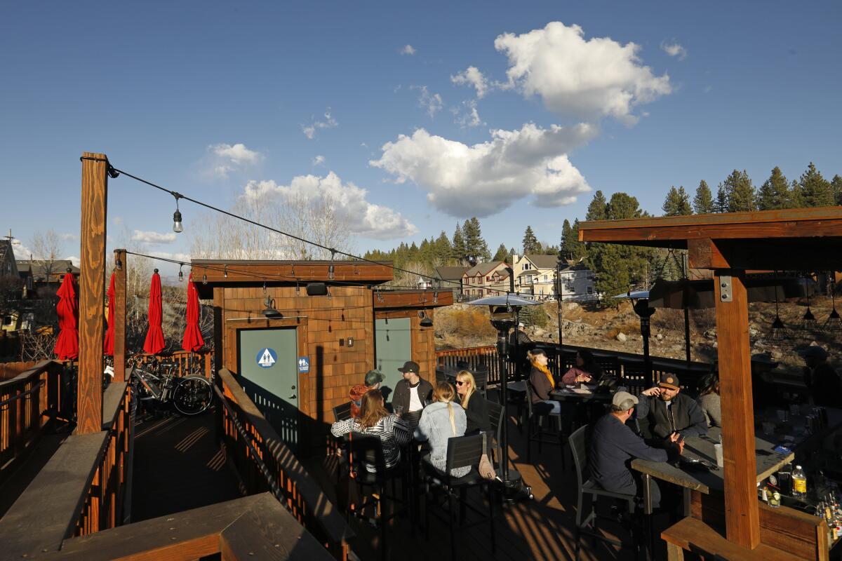 People enjoy outdoor dining in downtown Truckee. The deluge of remote workers is hard to miss in the town of 16,000.