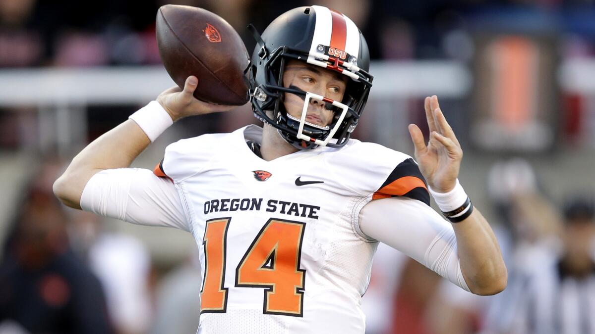 Oregon State quarterback Nick Mitchell unloads a pass against Utah during a game Oct. 31.