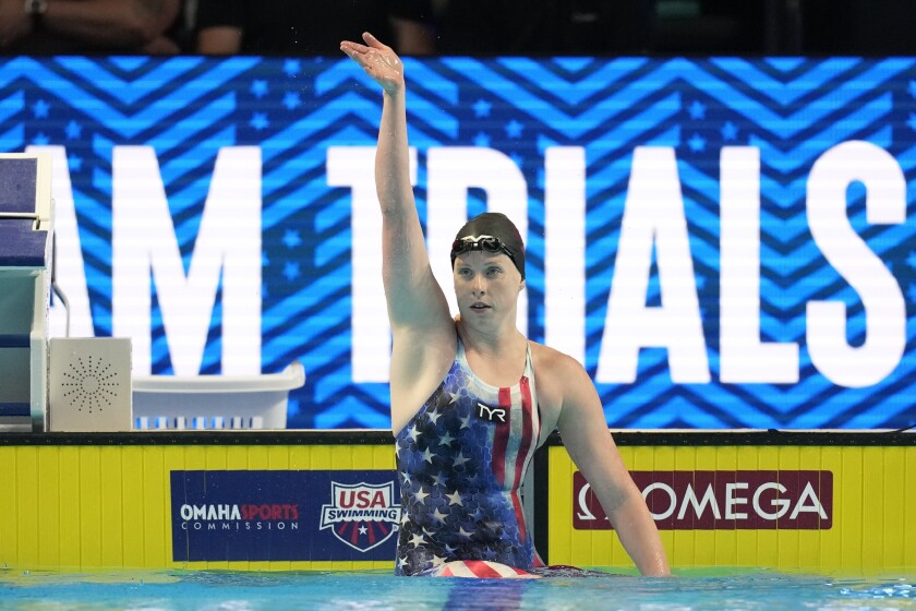 Lilly King reacts after winning the women's 100 breaststroke during wave 2 of the U.S. Olympic Swim Trials on Tuesday, June 15, 2021, in Omaha, Neb. (AP Photo/Charlie Neibergall)