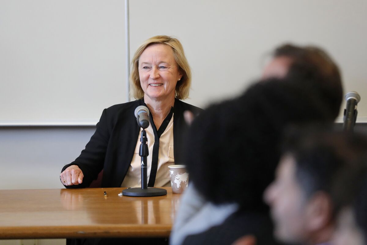 Anne McCall, chair of the U.S. section of the Scholars at Risk Network, welcomes scholars Thursday at a conference at UCI.