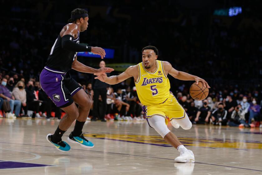 LOS ANGELES, CA - JANUARY 04: Los Angeles Lakers guard Talen Horton-Tucker (5) drives on the Sacramento Kings on Tuesday, Jan. 4, 2022 in Los Angeles, CA. (Jason Armond / Los Angeles Times)