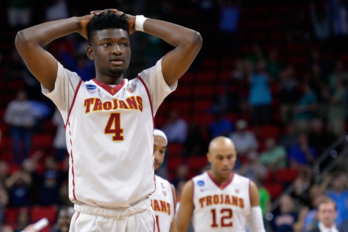 USC forward Chimezie Metu (4) walks off the court along with teammates after a 70-69 loss to Providence last season in the NCAA tournament.