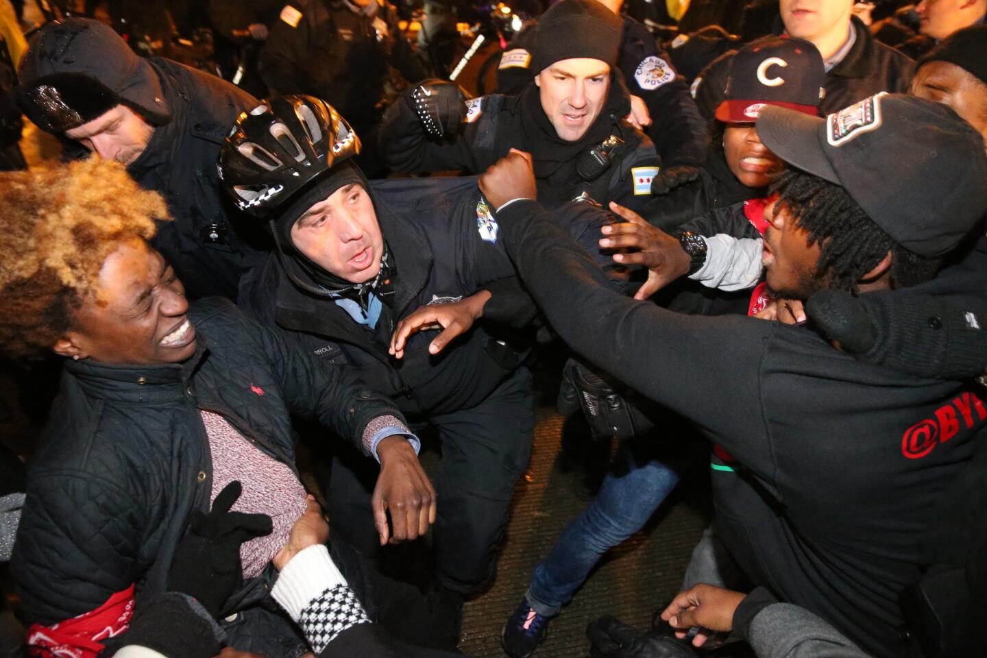 A scuffle breaks out as Chicago police try to stop protesters from crossing the Balbo Avenue bridge toward Columbus Drive on Nov. 24, 2015. The protests came after the city released a police dash-cam video showing black teenager Laquan McDonald being fatally shot by a Chicago police officer.