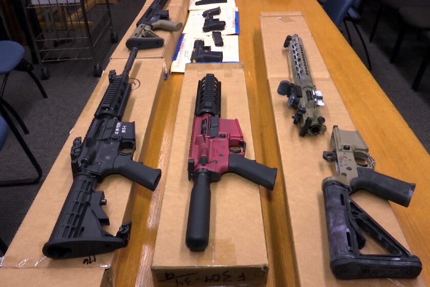 FILE - "Ghost guns" are displayed at the headquarters of the San Francisco Police Department in San Francisco, on Nov. 27, 2019. The Los Angeles City Council has passed a ban on “ghost guns” that police say represent an increasingly large share of the weapons used in violent crimes. The council’s unanimous vote Tuesday, Nov. 30, 2021, bans the possession, sale, receipt or purchase of the virtually untraceable guns — which are made from build-it-yourself kits. (AP Photo/Haven Daley, File)