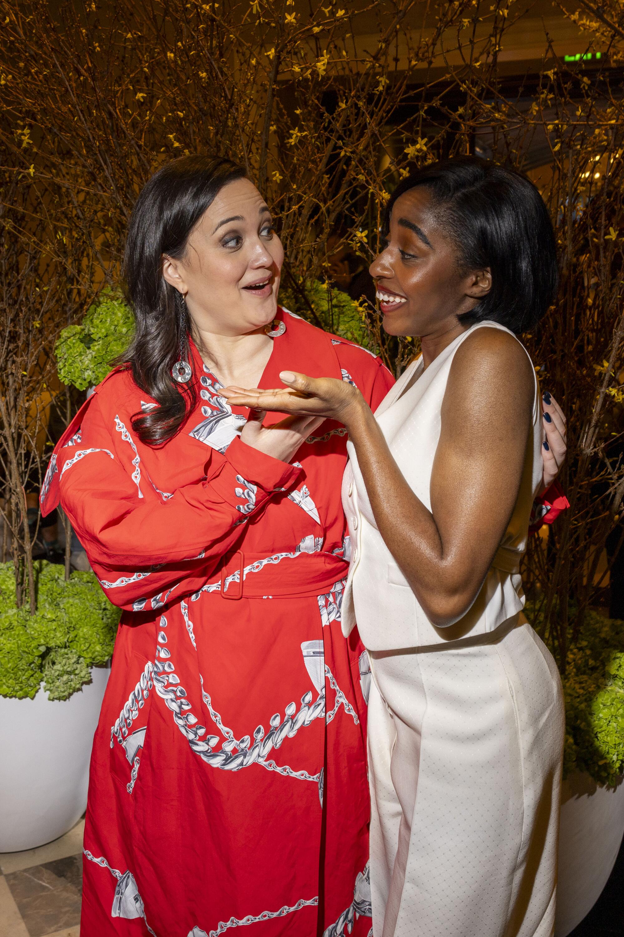 Two women clowning around at a party