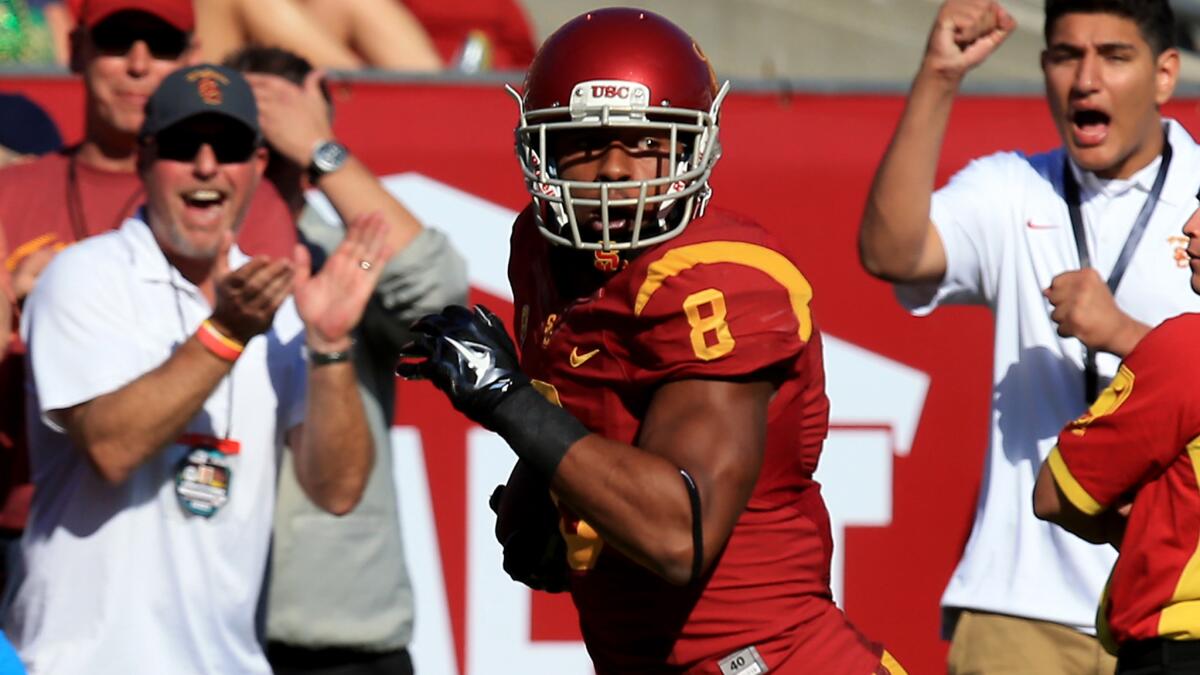 USC wide receiver George Farmer runs for a touchdown during a 49-14 victory over Notre Dame.