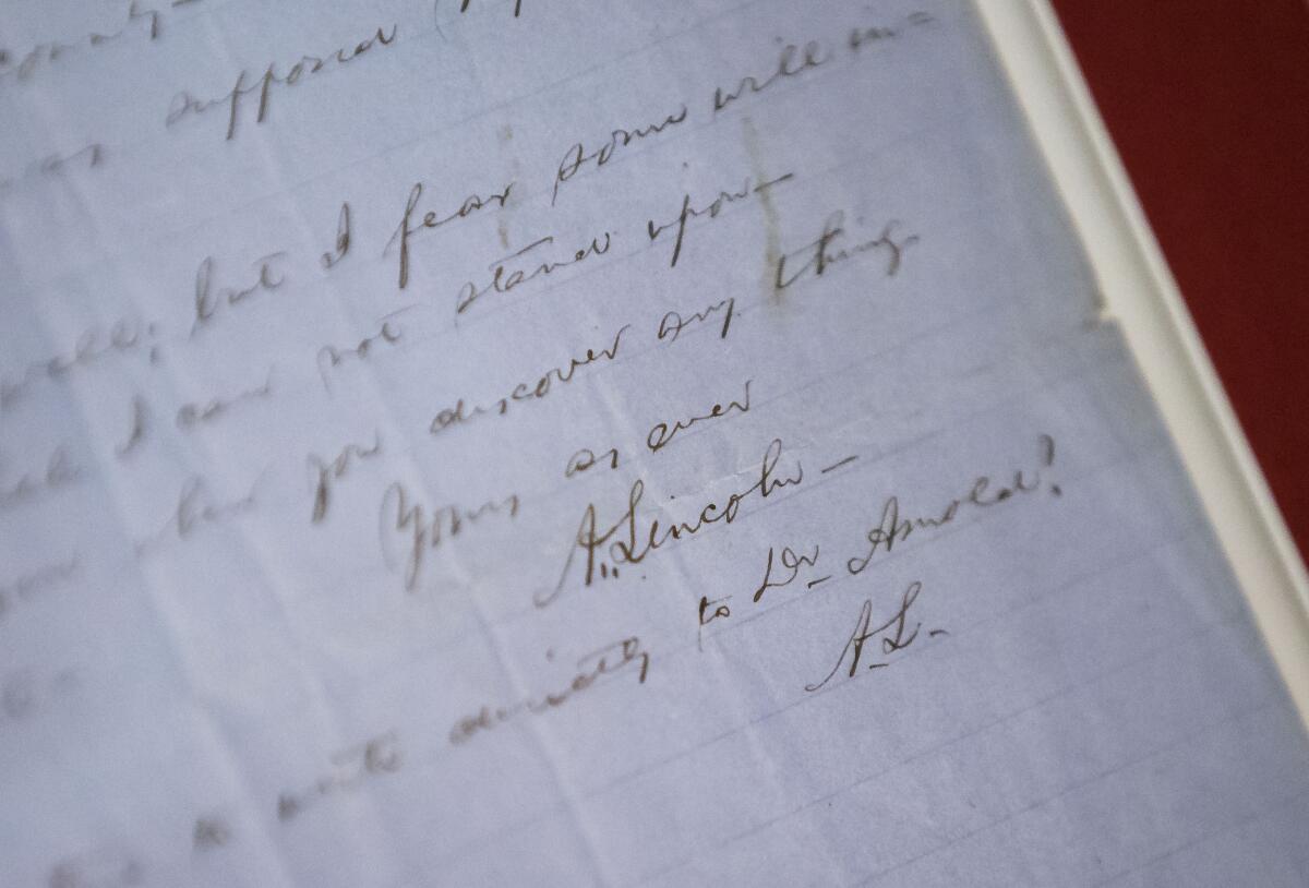 Abraham Lincoln's signature at the bottom of a 1854 handwritten letter donated to the Abraham Lincoln Presidential Library and Museum by Guy Fraker, of Bloomington, Ill., attorney, author and Lincoln collector, during a ceremony at the Abraham Lincoln Presidential Library in Springfield, Ill., Thursday, July 1, 2021. Abraham Lincoln's 1854 letter to Elihu Powell says that he has decided not to serve as a state representative again and according to scholars meant that he had his sights on the U.S. Senate. (Justin L. Fowler/The State Journal-Register via AP)