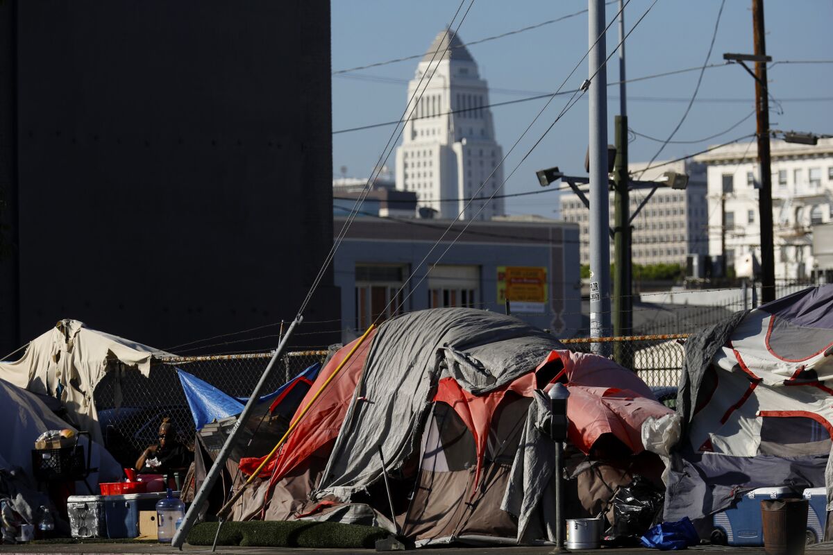 Tents line a street near East 6th Street and South Central Avenue in September. Police are searching for a suspect who attacked two homeless people with acid at a park in Mission Hills.