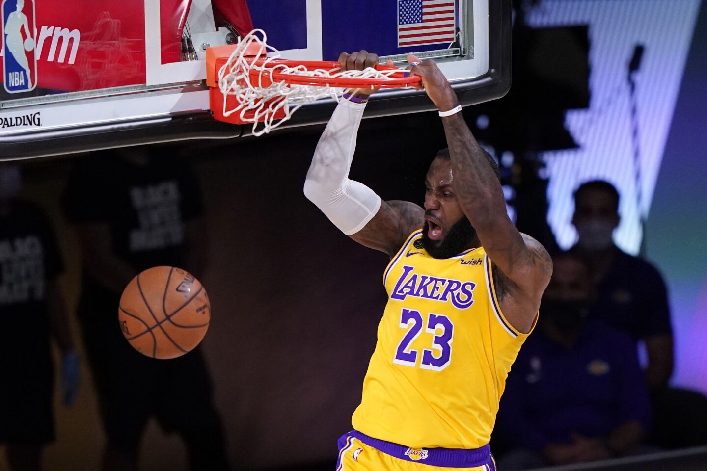 Lakers forward LeBron James dunks off a feed from Alex Caruso (not pictured) during Game 1.