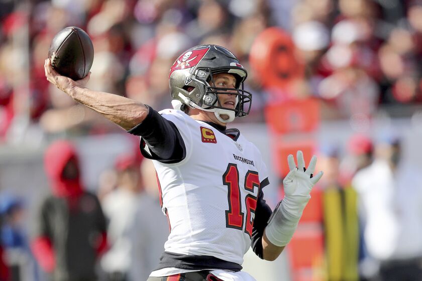 Tampa Bay Buccaneers quarterback Tom Brady (12) attempts a pass during a NFL divisional playoff football game.