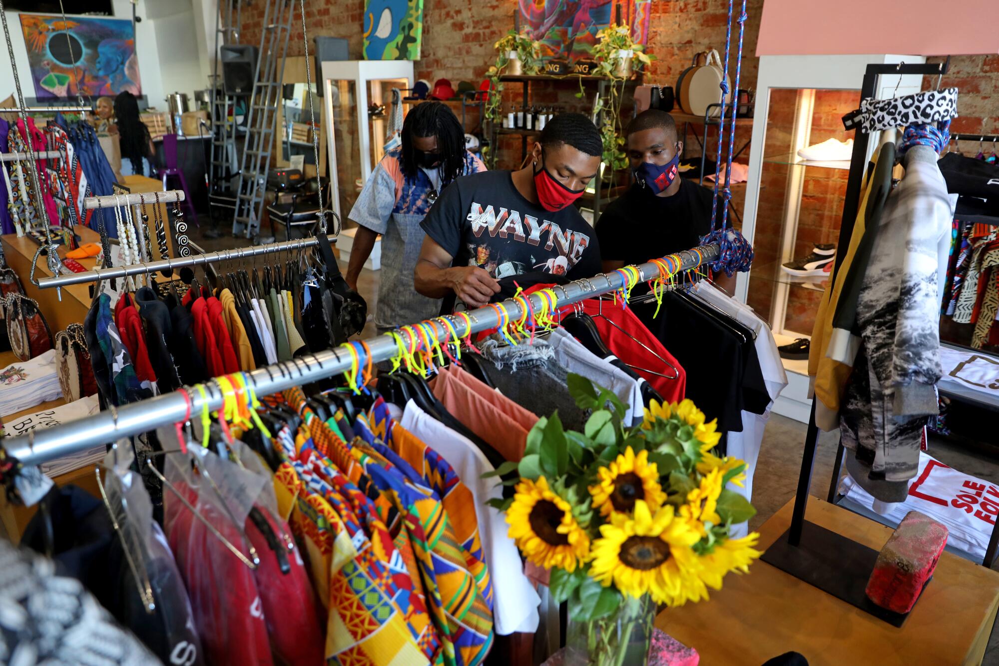 Shoppers browse clothing inside a store