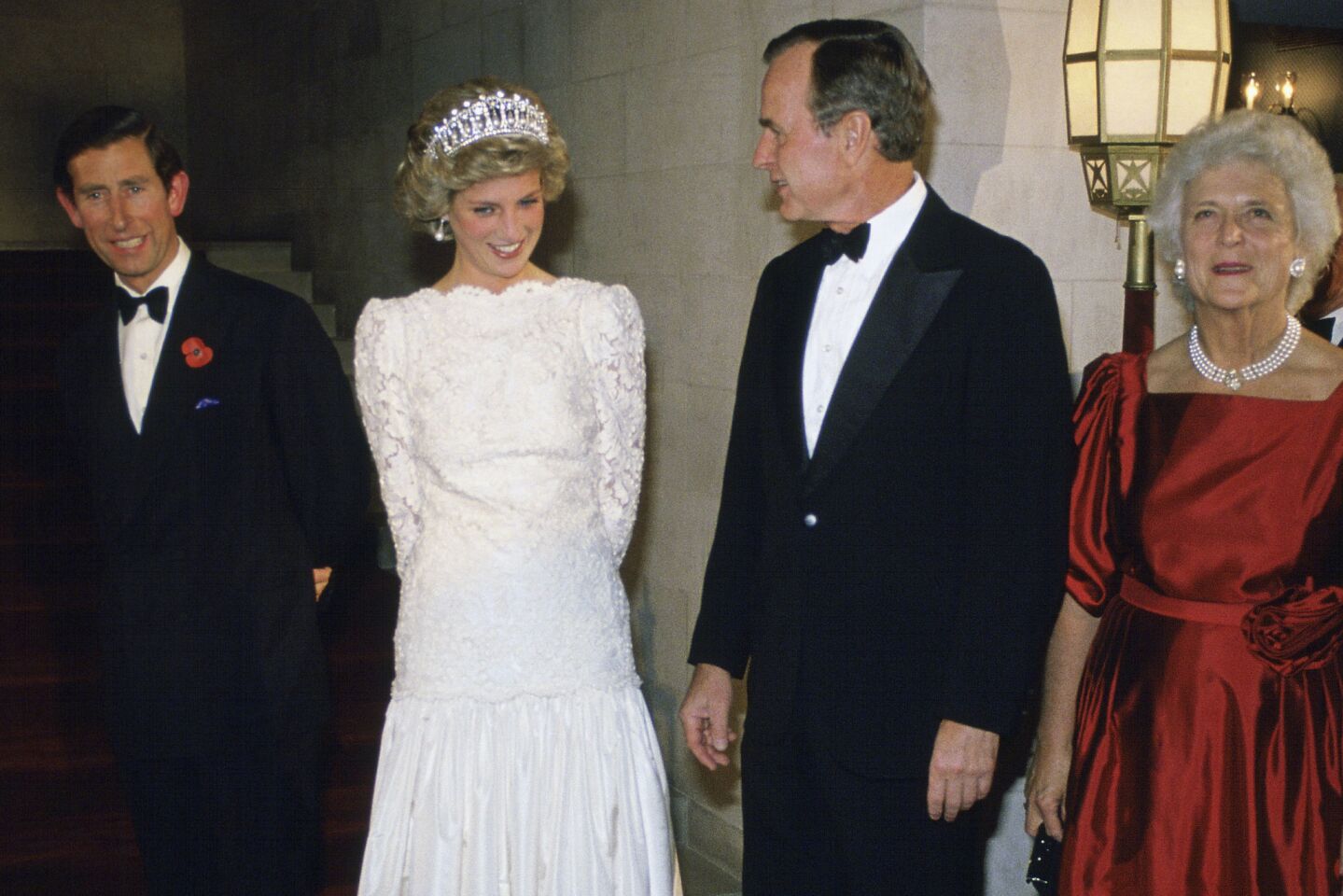 Prince Charles and Princess Diana meet Vice President George H.W. Bush and Barbara Bush at the British ambassador's residence in Washington in 1985.
