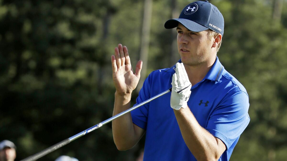 Jordan Spieth indicates Friday how far he missed a putt for par on the 17th green during the second round of the Masters.