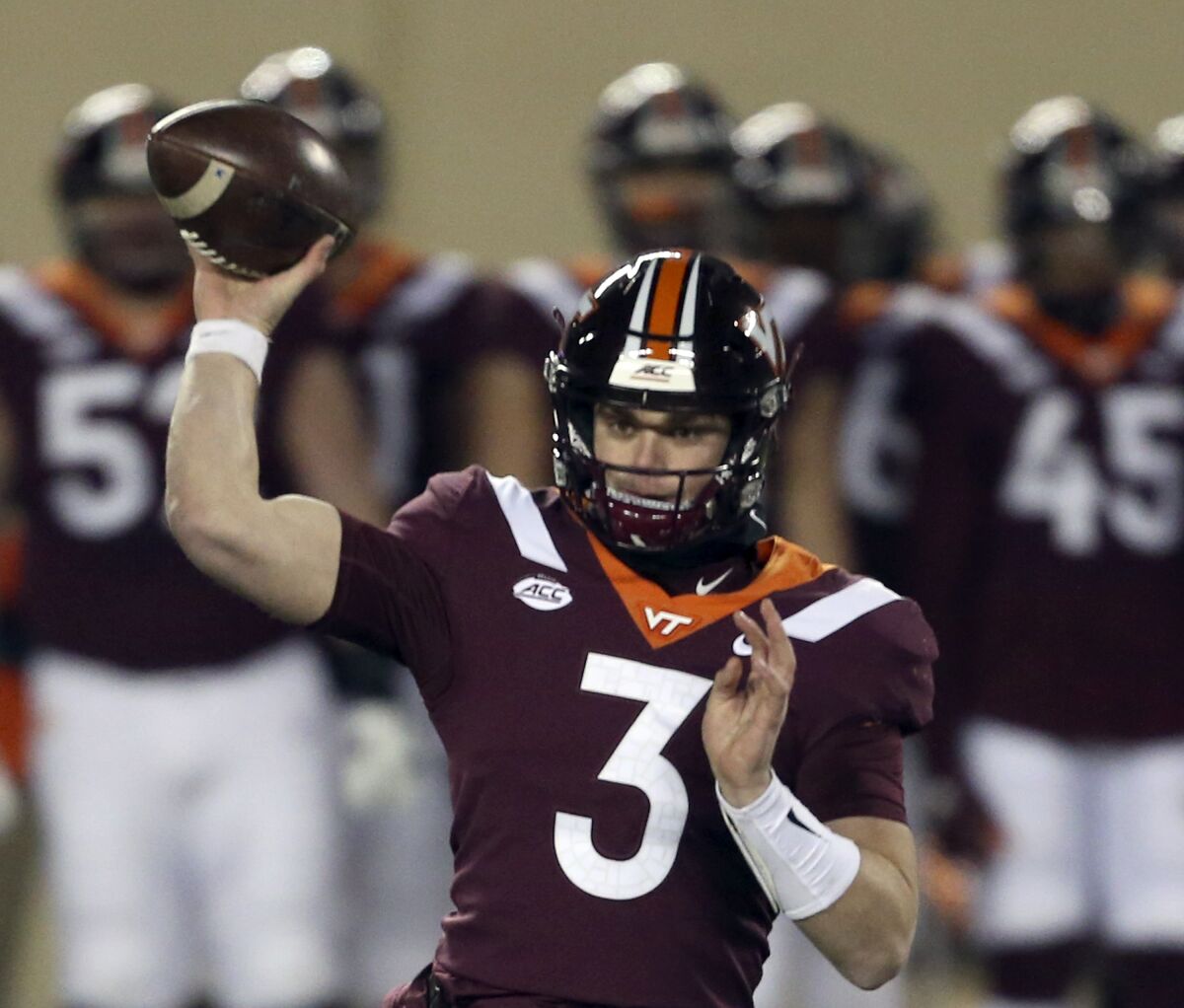 FILE - Virginia Tech quarterback Braxton Burmeister throws a pass during the first half against Clemson in an NCAA college football game in Blacksburg, Va., in this Saturday, Dec. 5, 2020, file photo. Few Power Five programs struggled through the pandemic more than Virginia Tech. Coach Justin Fuente and the Hokies hope to restore some order this season. (Matt Gentry/The Roanoke Times via AP, Pool, File)