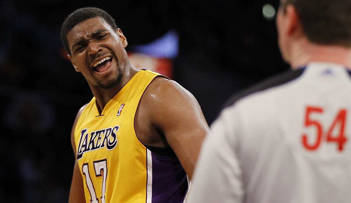 Lakers center Andrew Bynum pleads his case with referee Nick Buckert during a game.