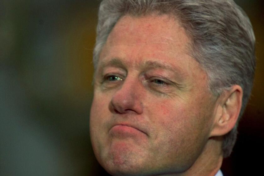 FILE - In this Dec. 19, 1998, file photo, President Bill Clinton looks on as Vice President Gore addresses members of congress outside the Oval Office after the House of Representatives voted to impeach the president. Donald Trump joins a small group of fellow presidents now that he's the subject of an official impeachment inquiry in the House of Representatives. Only three of his predecessors underwent similar proceedings: Andrew Johnson and Bill Clinton, who were acquitted after trials in the Senate, and Richard Nixon, who resigned to avoid being impeached in connection with the Watergate scandal. (AP Photo/Doug Mills, File)