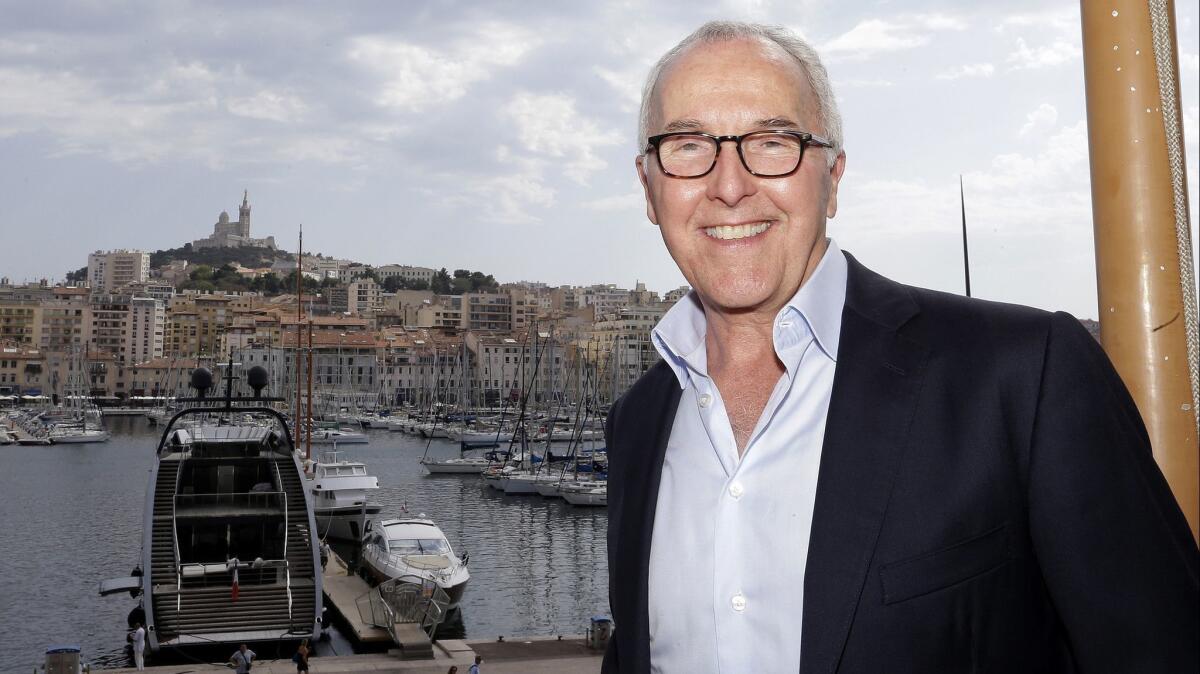 Frank McCourt, former owner of the Los Angeles Dodgers, smiles while standing near the old port of Marseilles in August 2016.