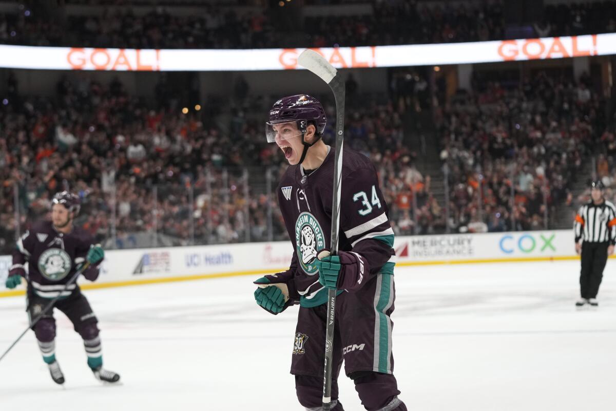 Ducks rookie defenseman Pavel Mintyukov celebrates after scoring his first career goal against the Hurricanes.