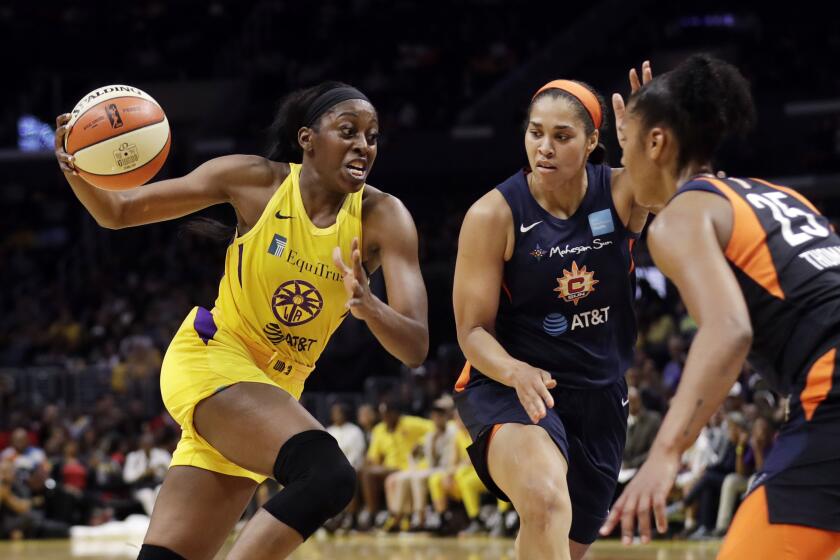 Los Angeles Sparks' Chiney Ogwumike, left, dribbles next to Connecticut Sun's Brionna Jones, center, and Alyssa Thomas, right, during the second half of a WNBA basketball game Friday, May 31, 2019, in Los Angeles. (AP Photo/Marcio Jose Sanchez)