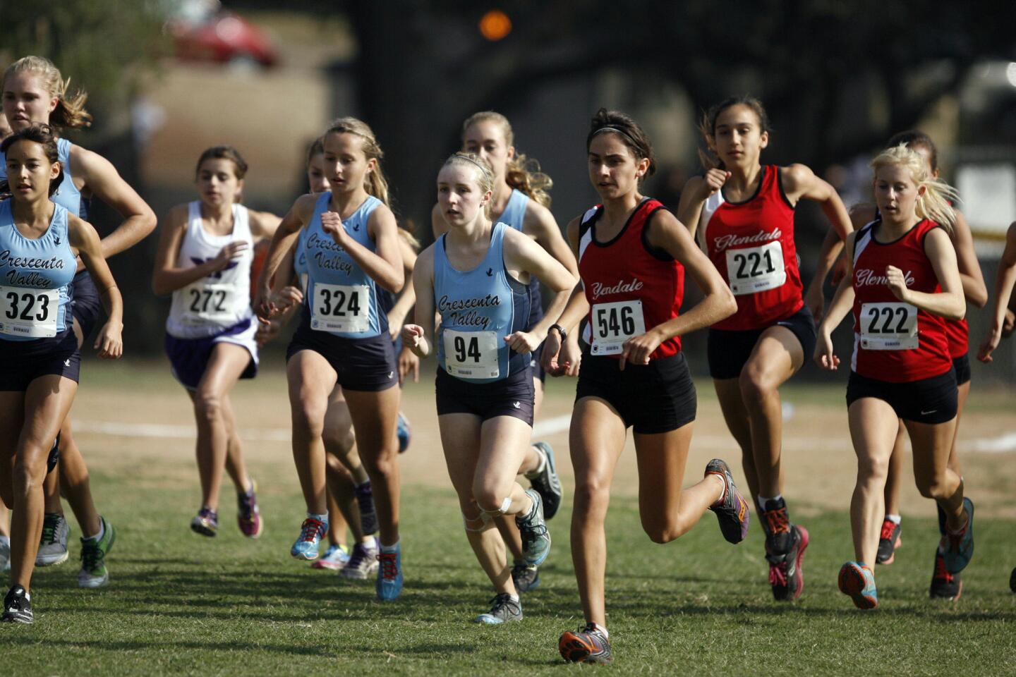 Runners sprint at the start line during a meet at Crescenta Valley Park on Thursday, November 1, 2012.