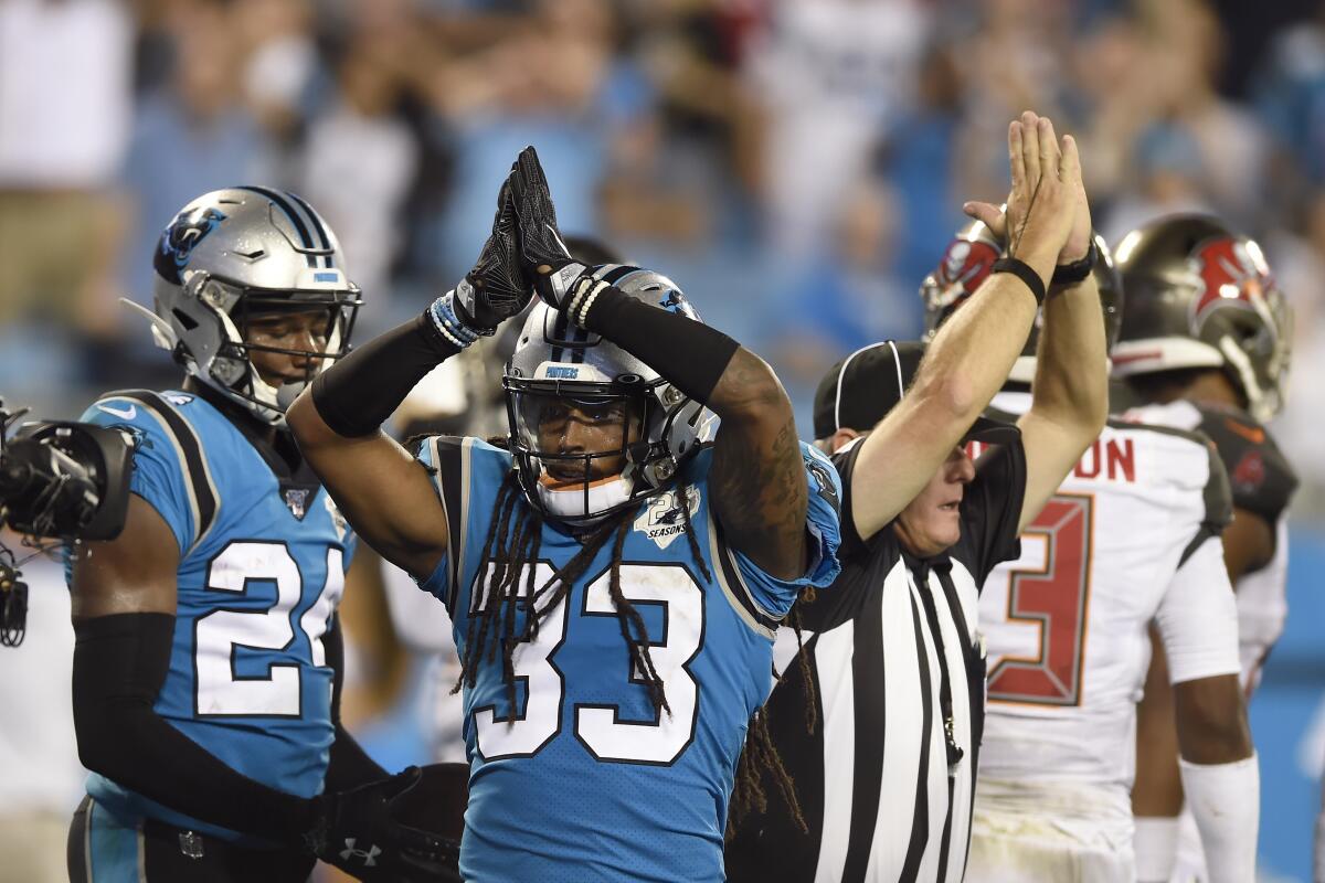 Carolina Panthers defensive back Tre Boston (33) signals a safety during the second half of an NFL football game against the Tampa Bay Buccaneers in Charlotte, N.C., Thursday, Sept. 12, 2019. (AP Photo/Mike McCarn)