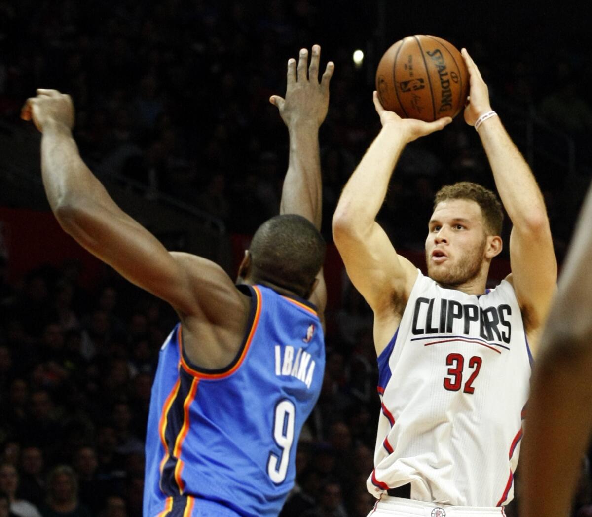 Blake Griffin takes a shot over the outstretched arm of Oklahoma City's Serge Ibaka on Dec. 21.