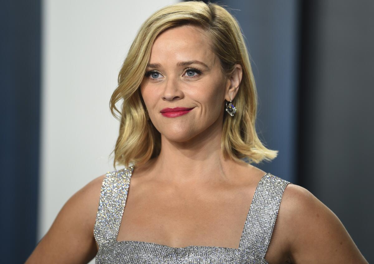 Reese Witherspoon in a silver dress.
