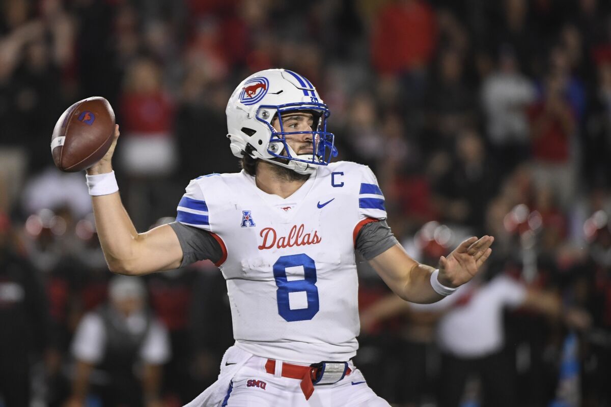 SMU quarterback Tanner Mordecai (8) throws the ball against Houston during the second half of an NCAA college football game Saturday, Oct. 30, 2021, in Houston. (AP Photo/Justin Rex)