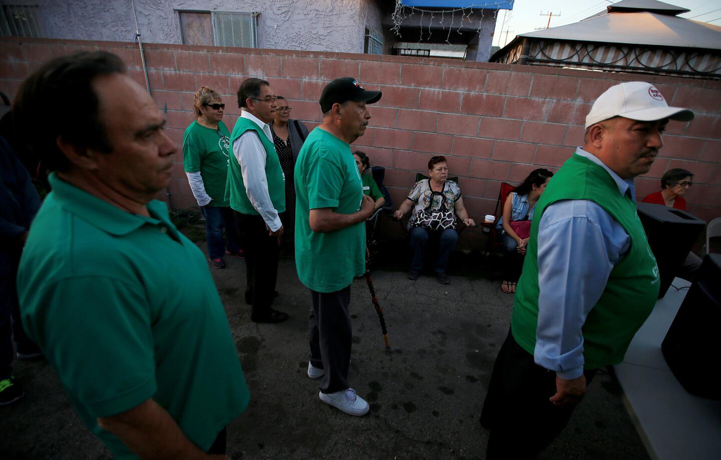 Community members and activists gather in a backyard of a home east of downtown Los Angeles to celebrate the closure of the Exide Tchnologies battery recycling plant.
