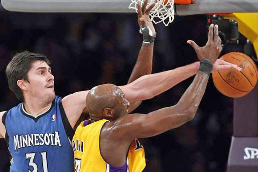 Darko Milicic plays against Lamar Odom and the Lakers in 2011.