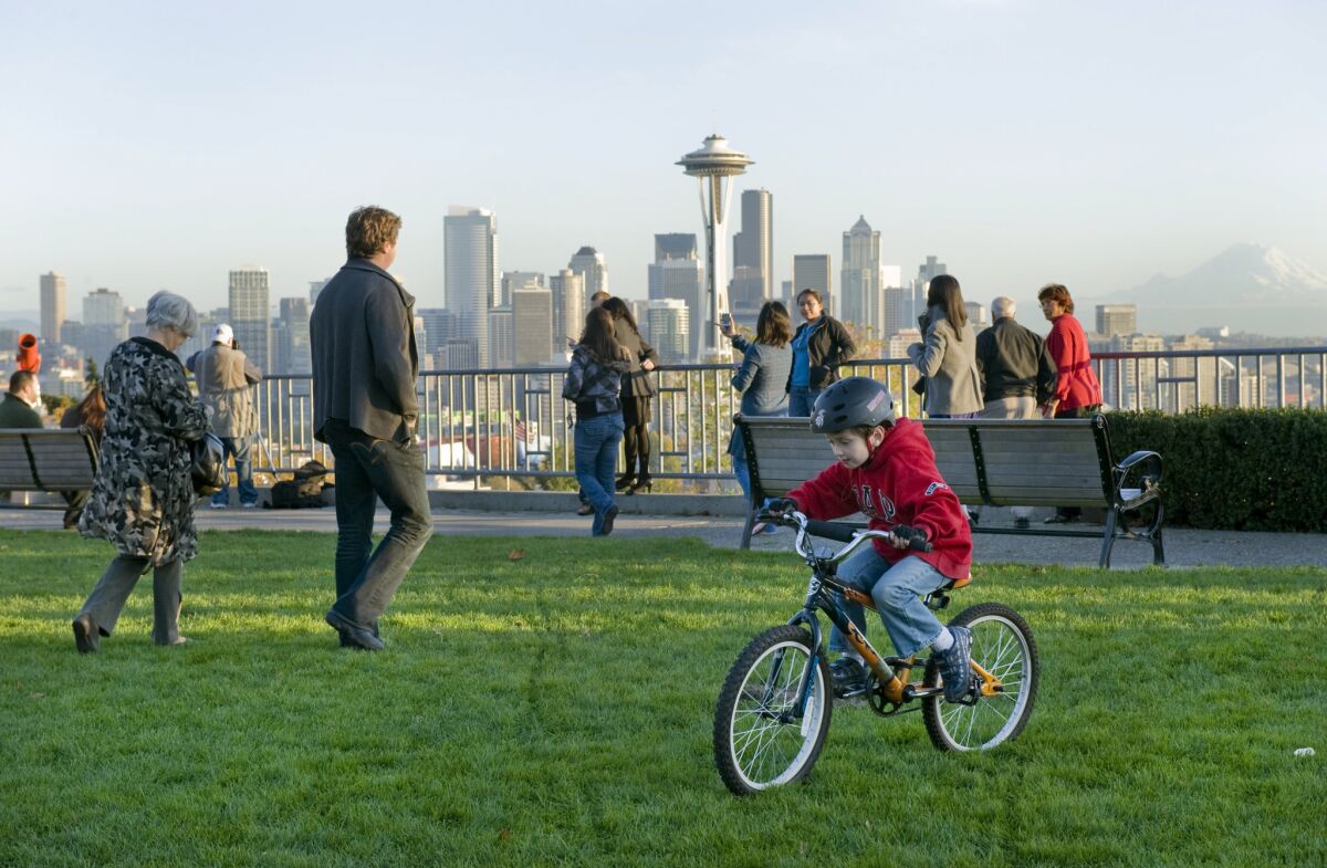 Visitors enjoy a view of Seattle from Kerry Park. (Mary Knox Merrill / Christian Science Monitor/Getty)