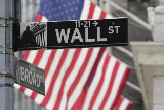 FILE - Signs marking the intersection of Broad and Walls Streets appear near the New York Stock Exchange on Oct. 1, 2024, in New York. (AP Photo/Peter Morgan, File)