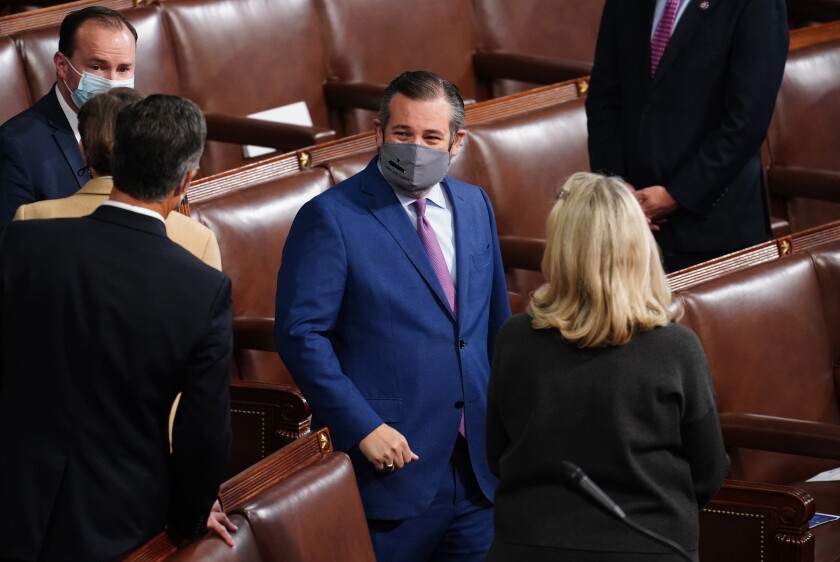 Sen. Ted Cruz, masked, arrives for the joint session of Congress on Jan. 6, 2021.