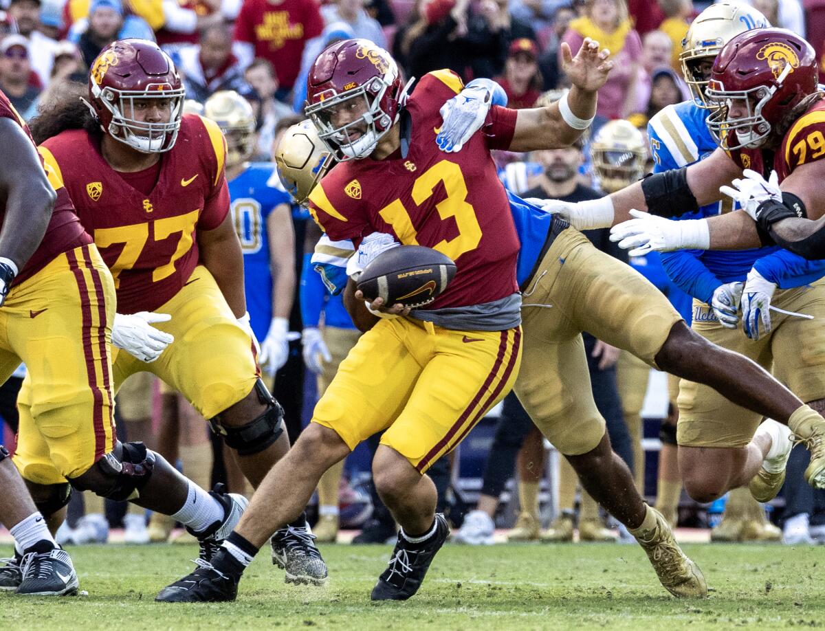USC quarterback Caleb Williams is sacked by UCLA defensive lineman Gabriel Murphy in the second quarter.