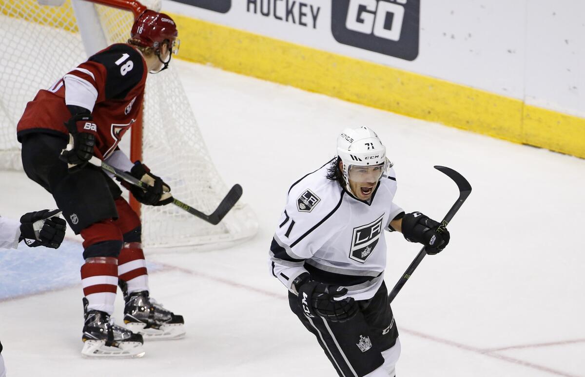 Kings center Jordan Nolan (71) celebrates his goal as Arizona Coyotes center Christian Dvorak (18) skates past during the second period on Dec. 1.