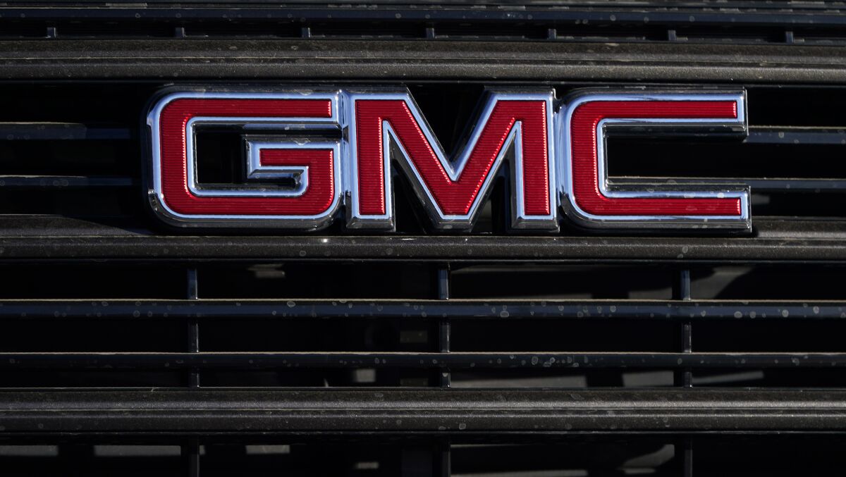 FILE - A GMC company logo is displayed at a GMC Truck dealership Sunday, Feb. 7, 2021, in Castle Rock, Colo. General Motors is recalling nearly 682,000 small SUVs, Friday, April 1, 2022, because the windshield wipers can fail.The recall covers the Chevrolet Equinox and GMC Terrain from the 2014 and 2015 model years (AP Photo/David Zalubowski, File)