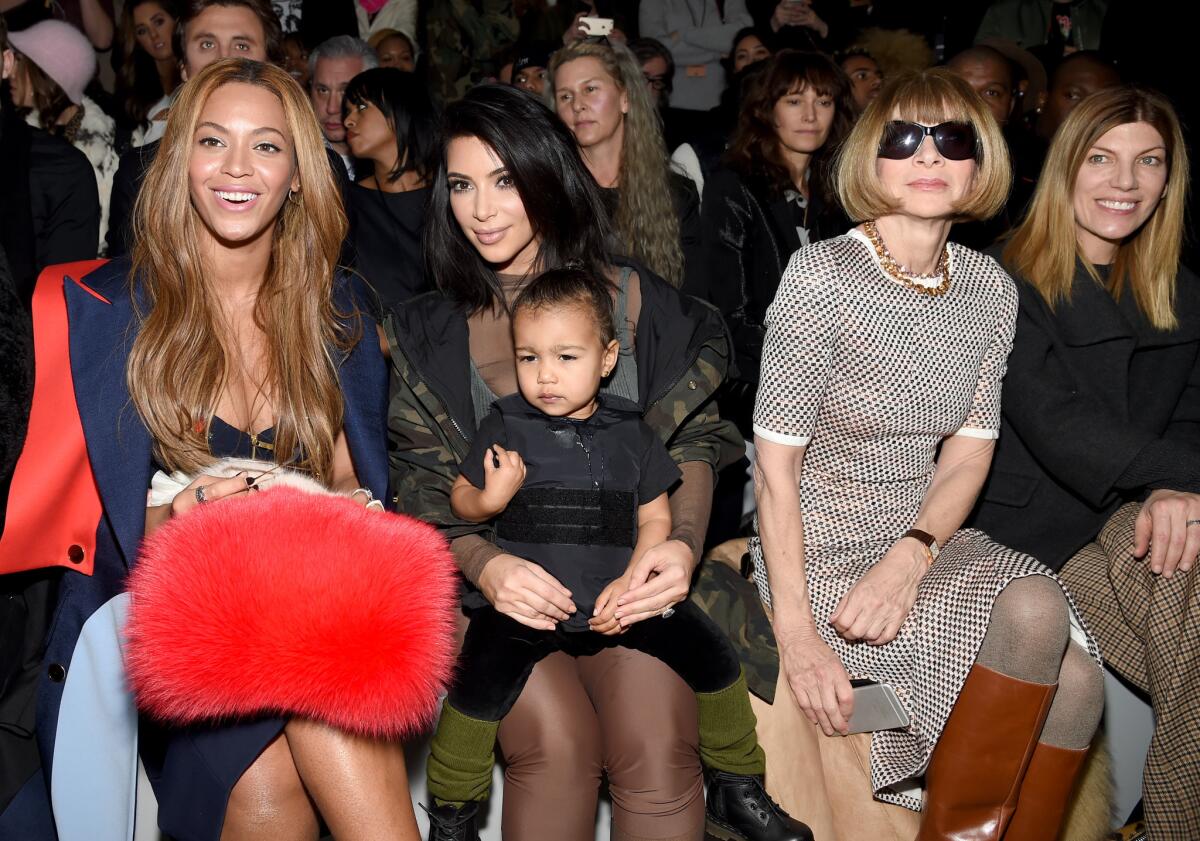 Beyonce, left, Kim Kardashian West with daughter North and Anna Wintour attend the Adidas Originals x Kanye West Yeezy Season 1 fashion show.