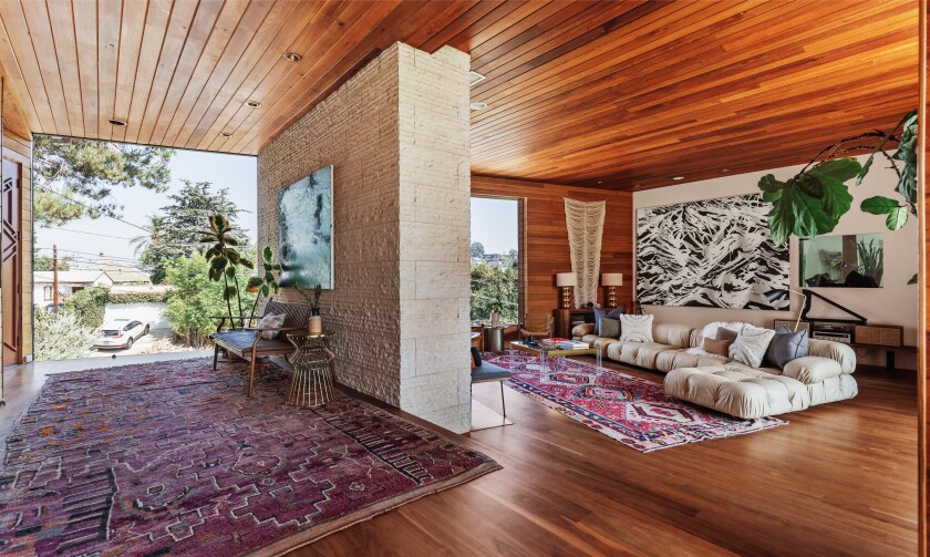 The striking contemporary home combines concrete, redwood and glass across 7,200 square feet.