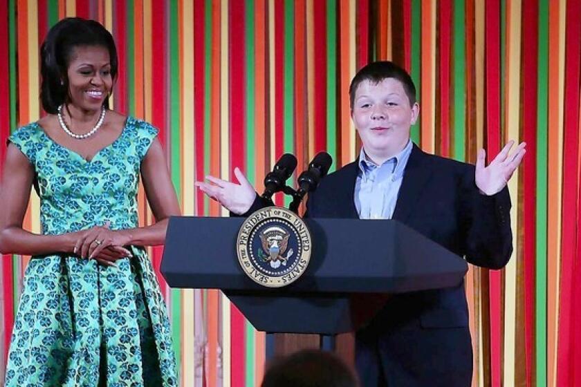Marshall Reid, a judge of the Healthy Lunchtime Challenge, speaks as First Lady Michelle Obama hosts a Kids' "State Dinner" luncheon at the White House on Aug. 20. Lessons on portion size and healthful diets should begin early.