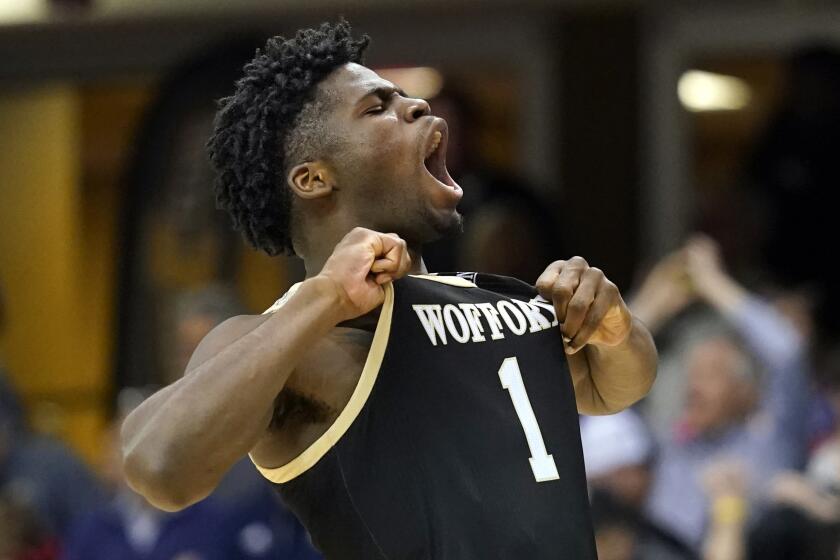 Wofford forward Chevez Goodwin (1) reacts to his team's win over Chattanooga 72-70 for the NCAA men's college semifinal basket game for the Southern Conference championship tournament, Sunday, March 8, 2020, in Asheville, N.C. (AP Photo/Kathy Kmonicek)