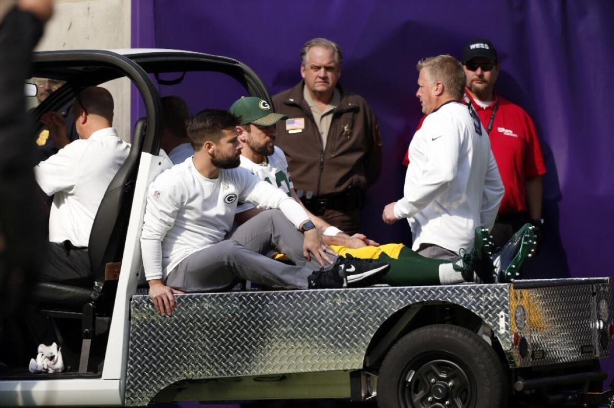 Green Bay Packers quarterback Aaron Rodgers was carted off the field in the first quarter of a game against the Vikings after suffering a right shoulder injury.