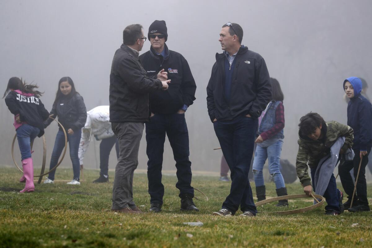 Riverside Unified School District officials observe activities at Riley's Farm.