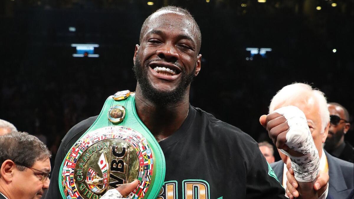 Deontay Wilder celebrates after knocking out Dominic Breazeale in the first round of their WBC title fight on May 18.